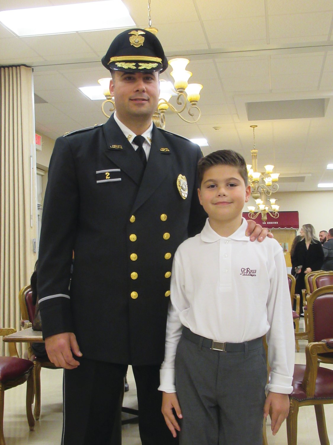 PROUD POP: Johnston Police Department Deputy Chief Mark Vieira is joined by his son, Anthony, who was called upon to give the Pledge of Allegiance for the recent Recognition of Excellence Awards Ceremony.